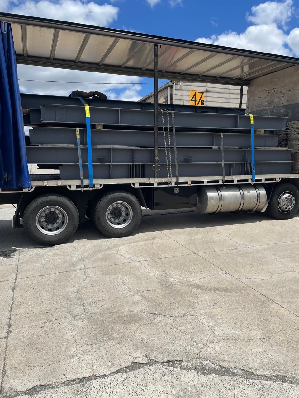 Steel components secured on a flatbed trailer